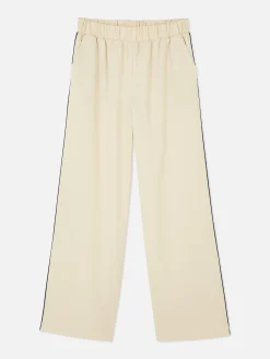 Matchende Joggingbroek Met Wijde Pijpen En Zijstreep