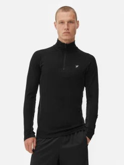 Sporttop Met Kwartrits En Lange Mouwen